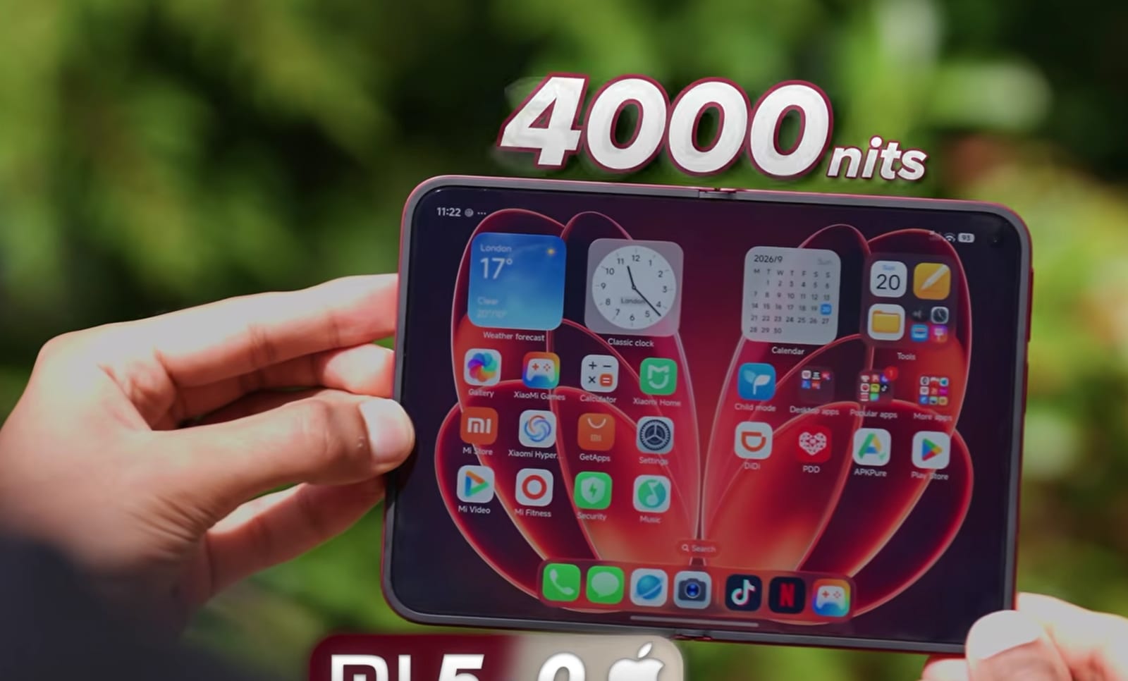 The Xiaomi 18 Fold unfolded outdoors with a graphic reading 4000 nits.