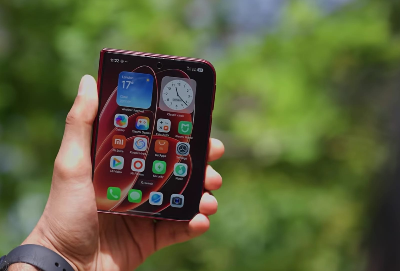 Xiaomi 18 Fold folded, showing its 5.4-inch cover display in a deep red finish.