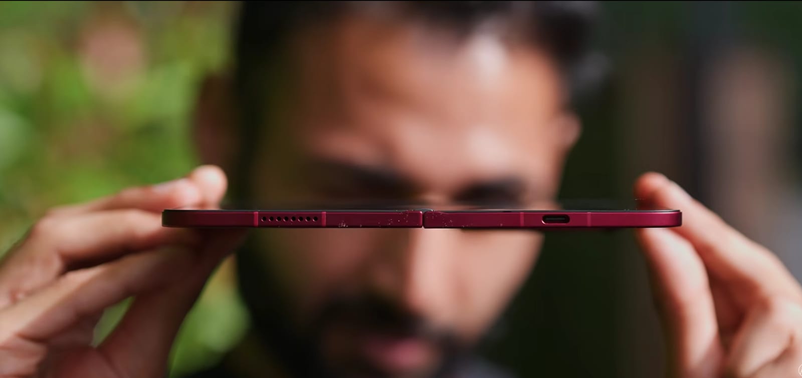 The Xiaomi 18 Fold viewed edge-on, highlighting how thin each half is when unfolded.