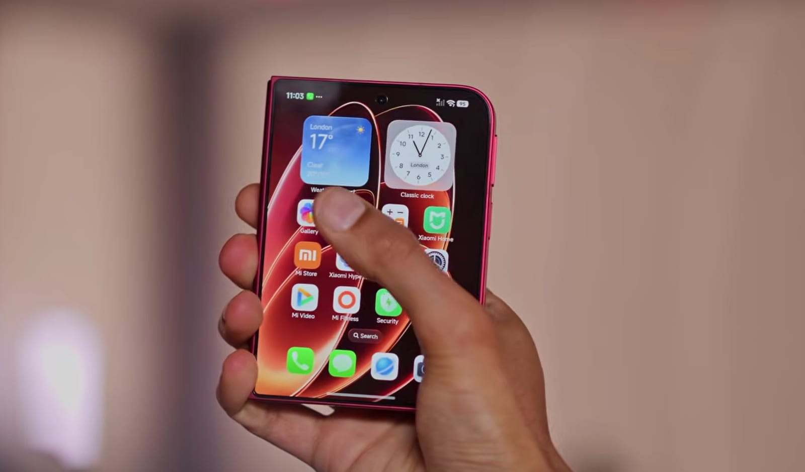 The Xiaomi 18 Fold's cover display showing its home screen and widgets.